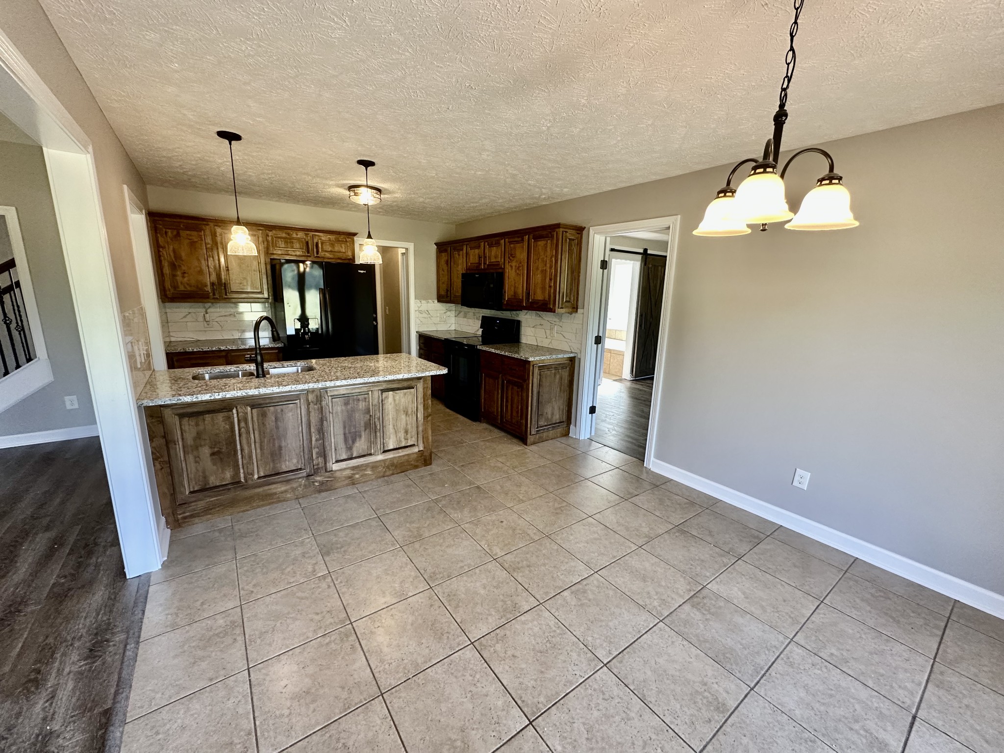216 Clubbs Road Portland, TN 37148 - Photo 5 of 14 a view of living room kitchen and microwave