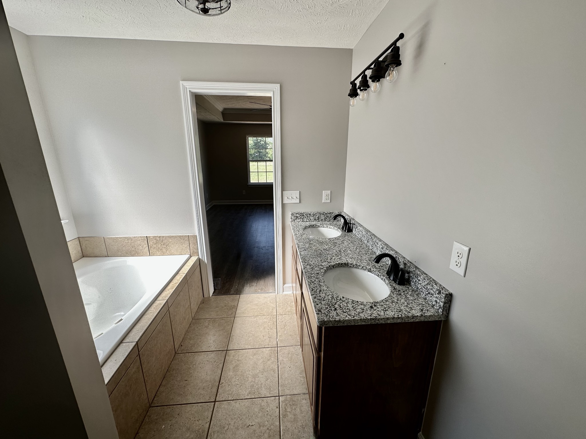 216 Clubbs Road Portland, TN 37148 - Photo 8 of 14 a bathroom with a granite countertop sink and mirror