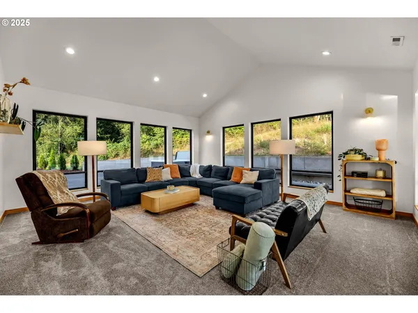 a living room with furniture and a large window
