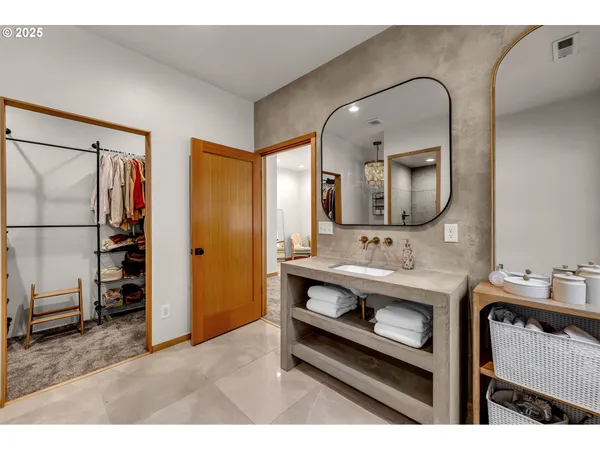 a bathroom with a sink a mirror and a toilet