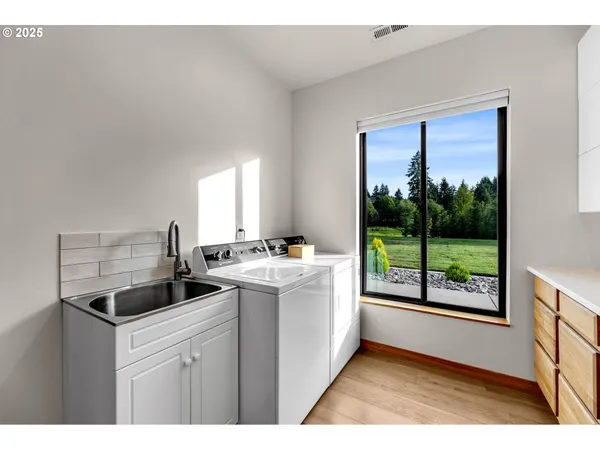 a kitchen that has a sink and a stove