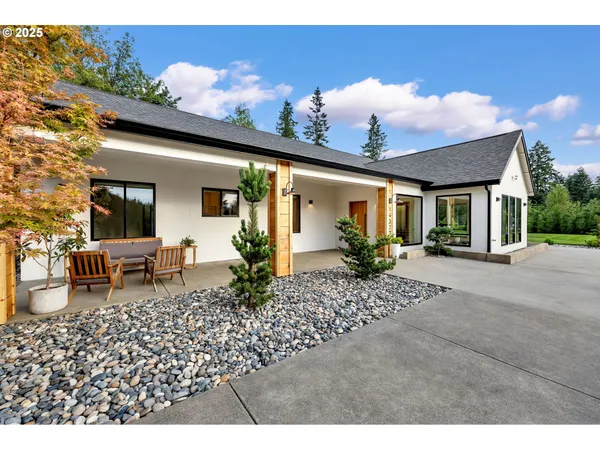 a front view of a house with garden