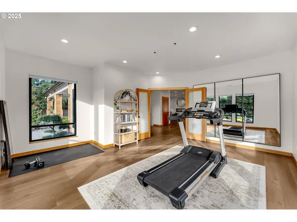 a room with lots of furniture and view of living room