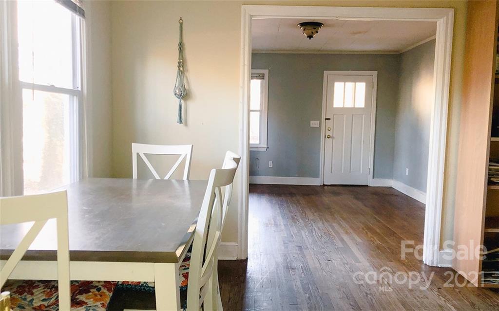 823 Deerwood Road Lancaster, SC 29720 - Photo 3 of 16 a view of a dining room with furniture and wooden floor