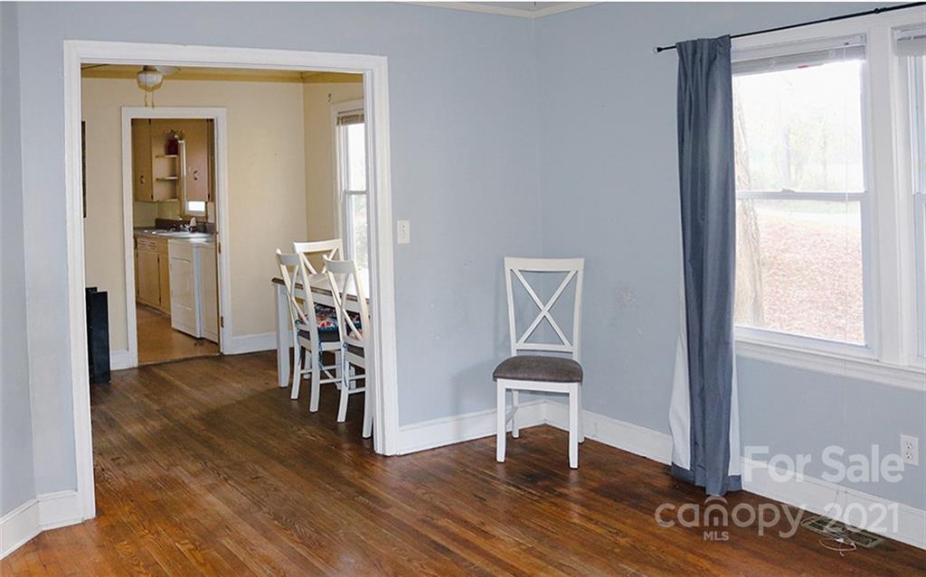 823 Deerwood Road Lancaster, SC 29720 - Photo 5 of 16 a view of an empty room with wooden floor and a window