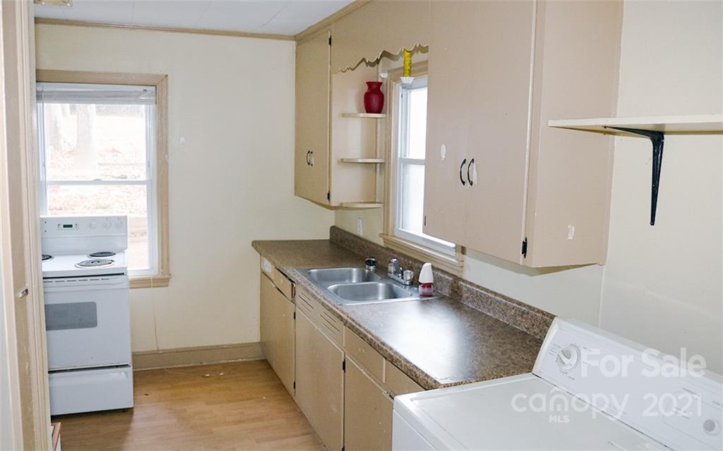 823 Deerwood Road Lancaster, SC 29720 - Photo 7 of 16 a bathroom with a sink and a mirror