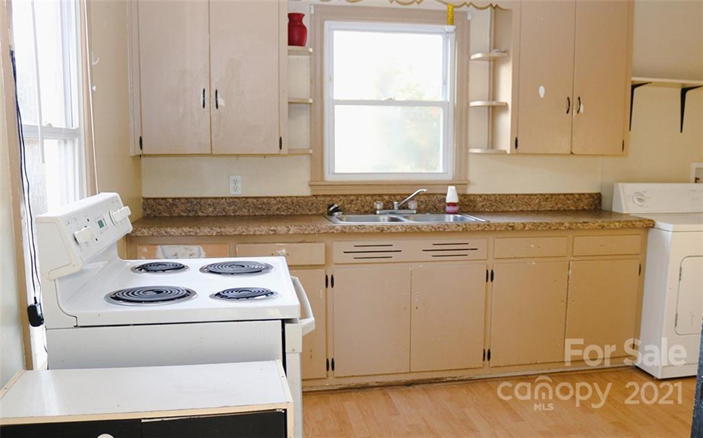 823 Deerwood Road Lancaster, SC 29720 - Photo 8 of 16 a kitchen with cabinets appliances and a window