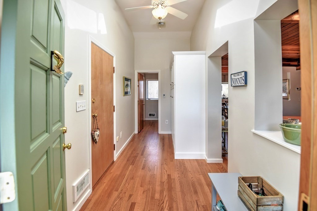 56 Chattanooga Road Ipswich, MA 01938 - Photo 24 of 37 a view of a hallway with wooden floor and closet