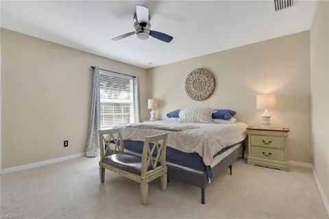 a bedroom with a bed and a table