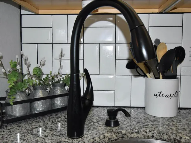 a kitchen with a sink stove and microwave