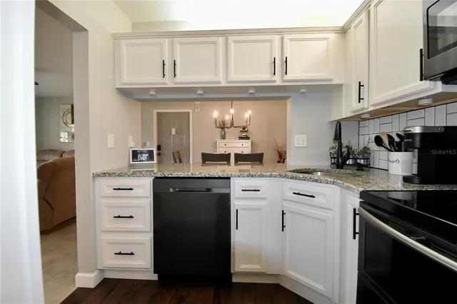 a view of a hallway with washer and dryer