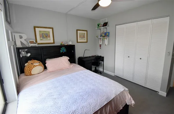 a white toilet sitting next to a bath tub