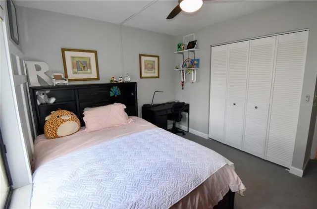 a white toilet sitting next to a bath tub