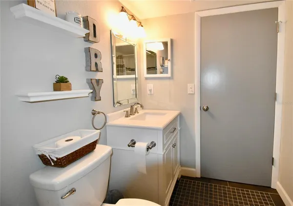 a bed room with a bed and a tv