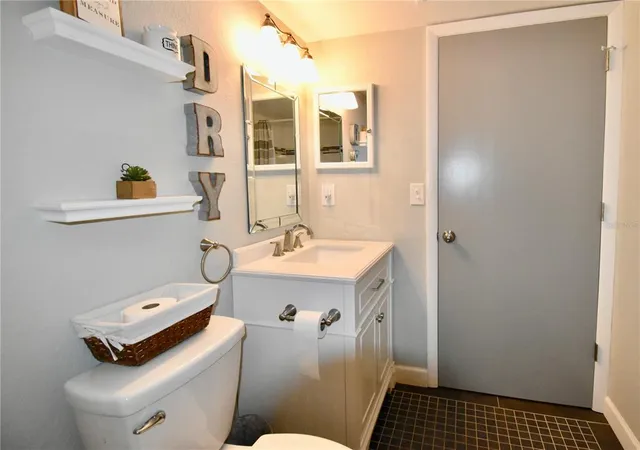 a bed room with a bed and a tv