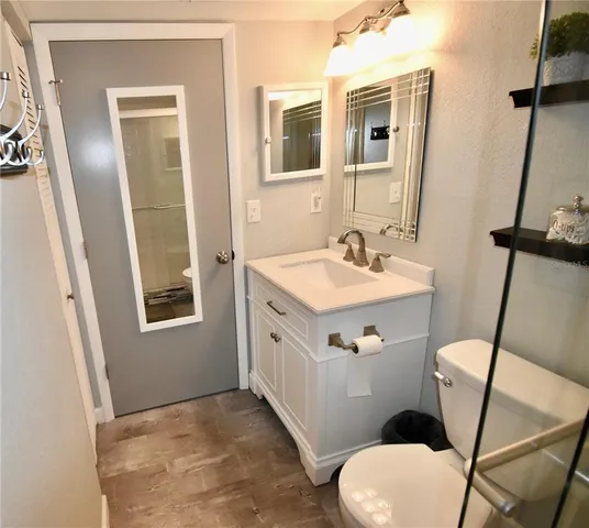 a view of a chairs and table in the balcony