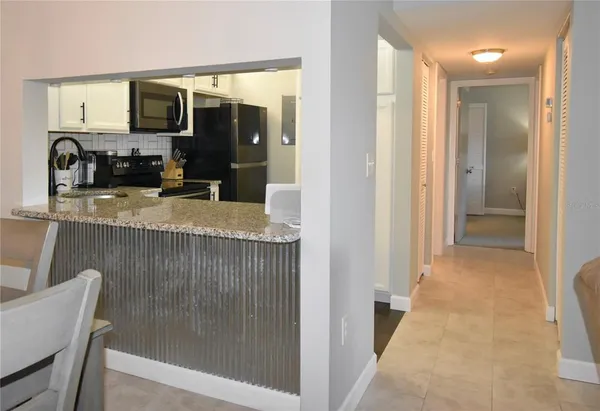 a view of a kitchen from the hallway