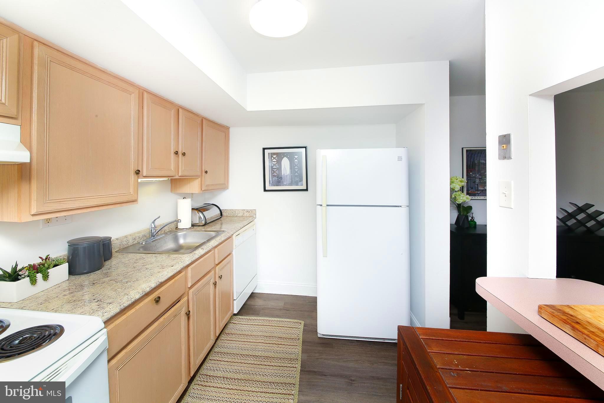 62 Shannon Road North Wales, PA 19454 - Photo 11 of 20 a kitchen with stainless steel appliances granite countertop a refrigerator sink and white cabinets