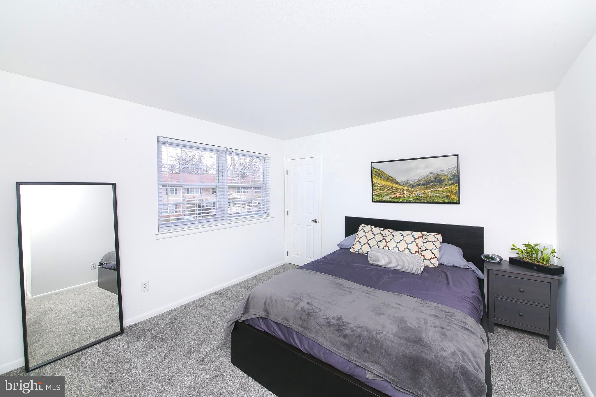 62 Shannon Road North Wales, PA 19454 - Photo 12 of 20 a bed sitting in a bedroom next to a window