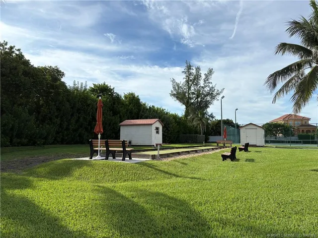 a park with a bench and trees
