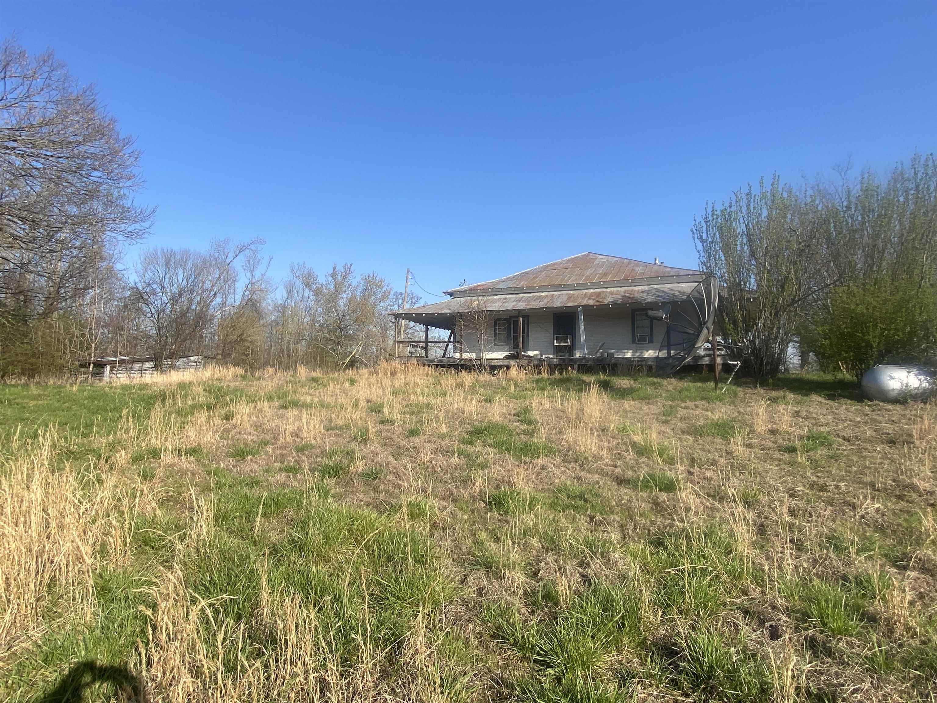 5405 Coffee Landing Road Morris Chapel, TN 38361 - Photo 26 of 32 a swimming pool with outdoor seating and yard