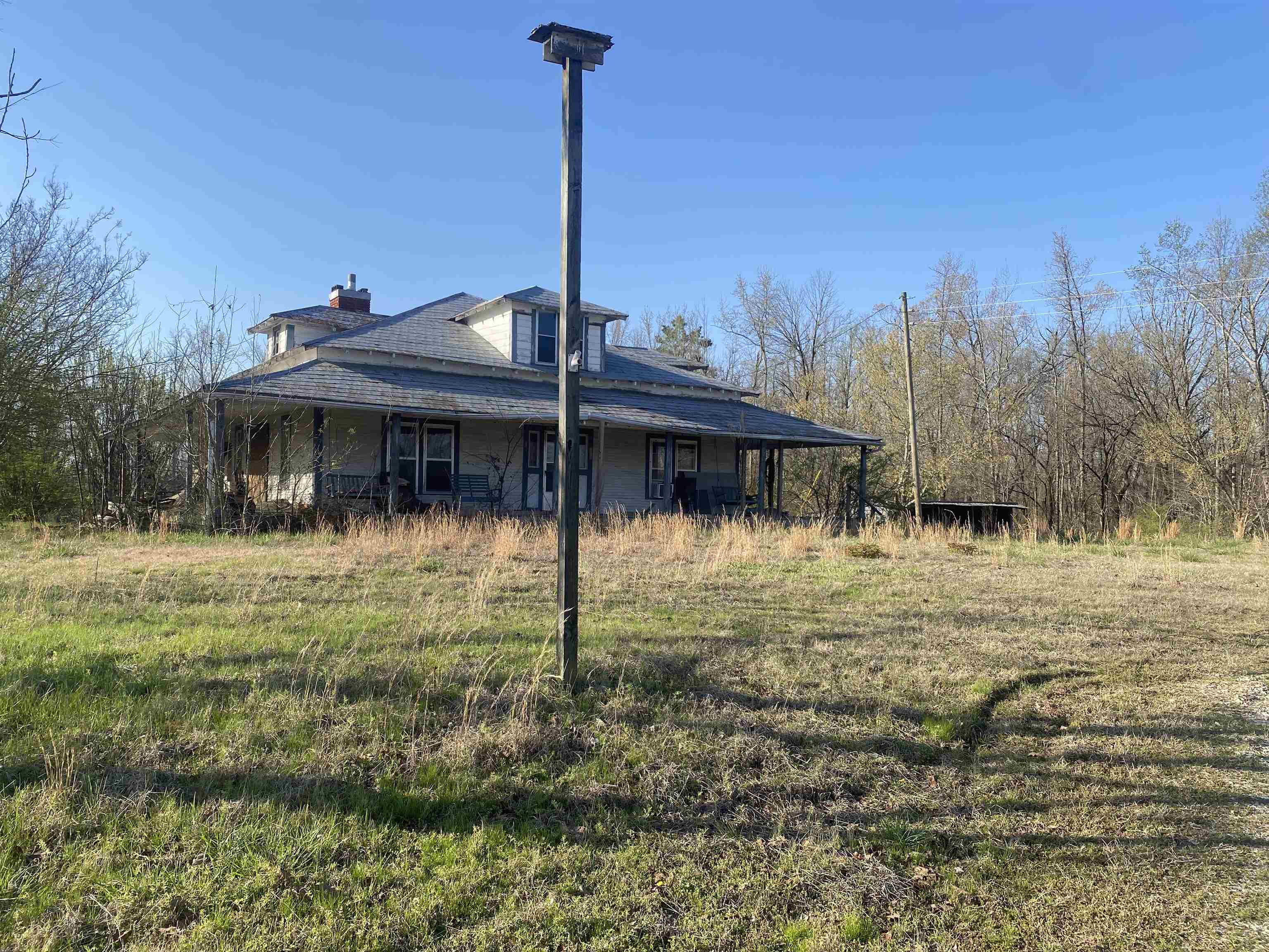 5405 Coffee Landing Road Morris Chapel, TN 38361 - Photo 5 of 32 a backyard of a house with table and chairs