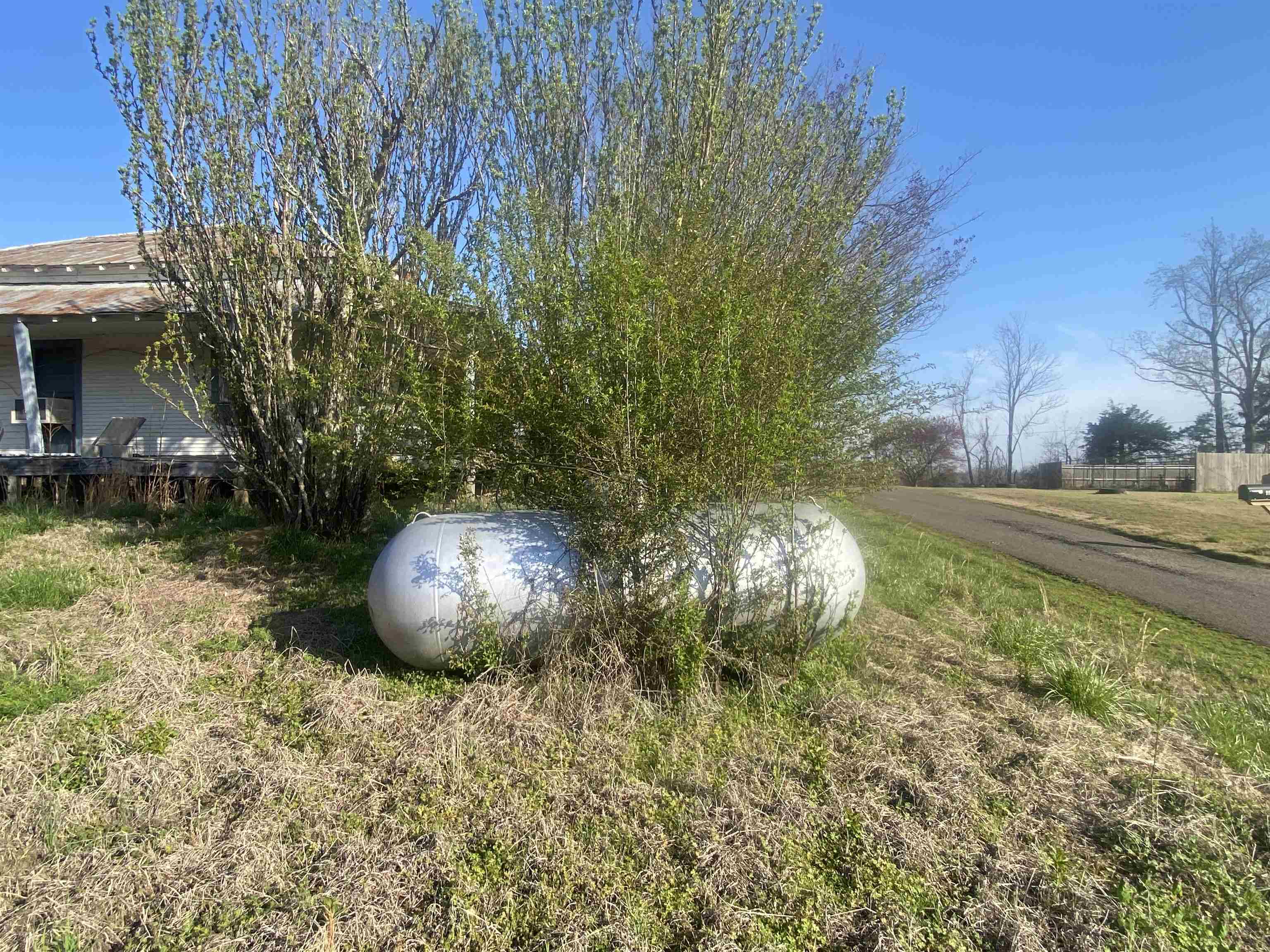 5405 Coffee Landing Road Morris Chapel, TN 38361 - Photo 6 of 32 a view of a wooden house with a yard