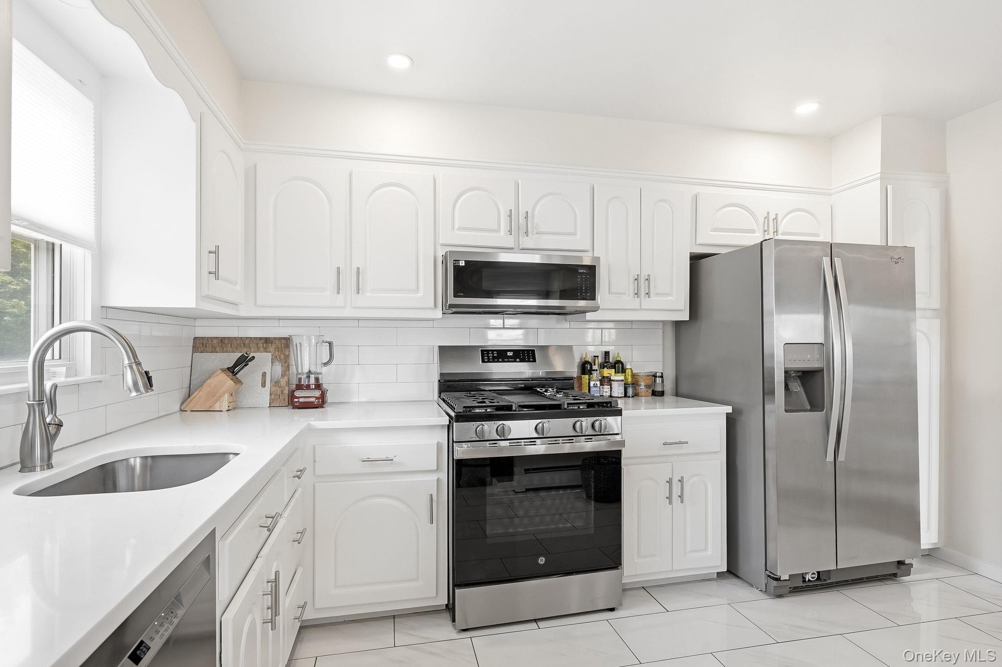 56 Wainwright Street Rye, NY 10580 - Photo 4 of 17 Renovated Kitchen with Stainless Appliances
