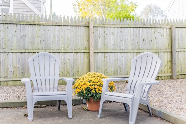 a balcony with a table and chairs
