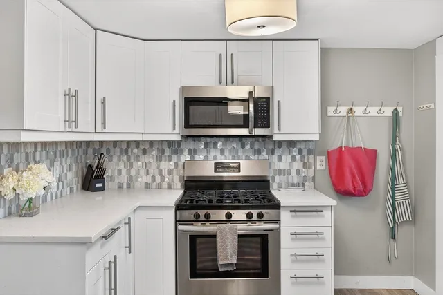 a kitchen with a stove and a microwave