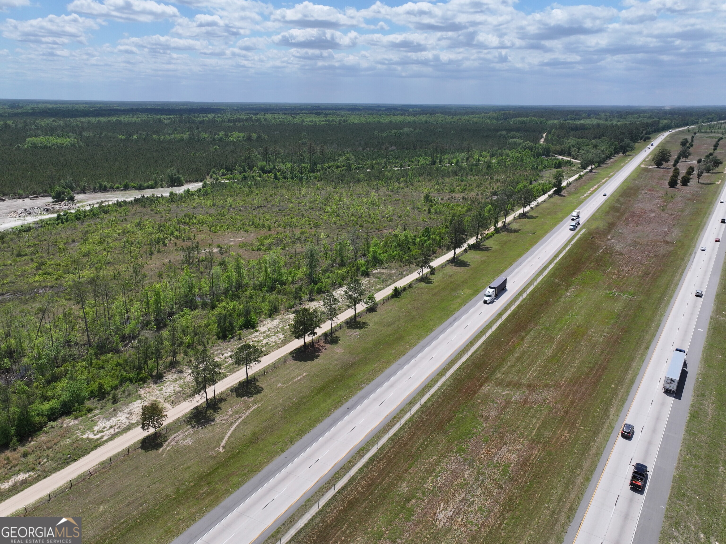 0 Newtown Road Pembroke, GA 31321 - Photo 3 of 6 a view of a lake with a city view