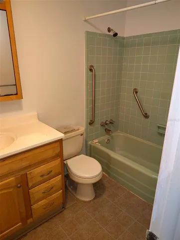 a bathroom with a toilet a sink and bathtub