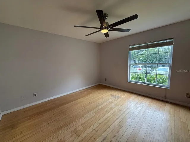 a view of livingroom with a ceiling fan and window