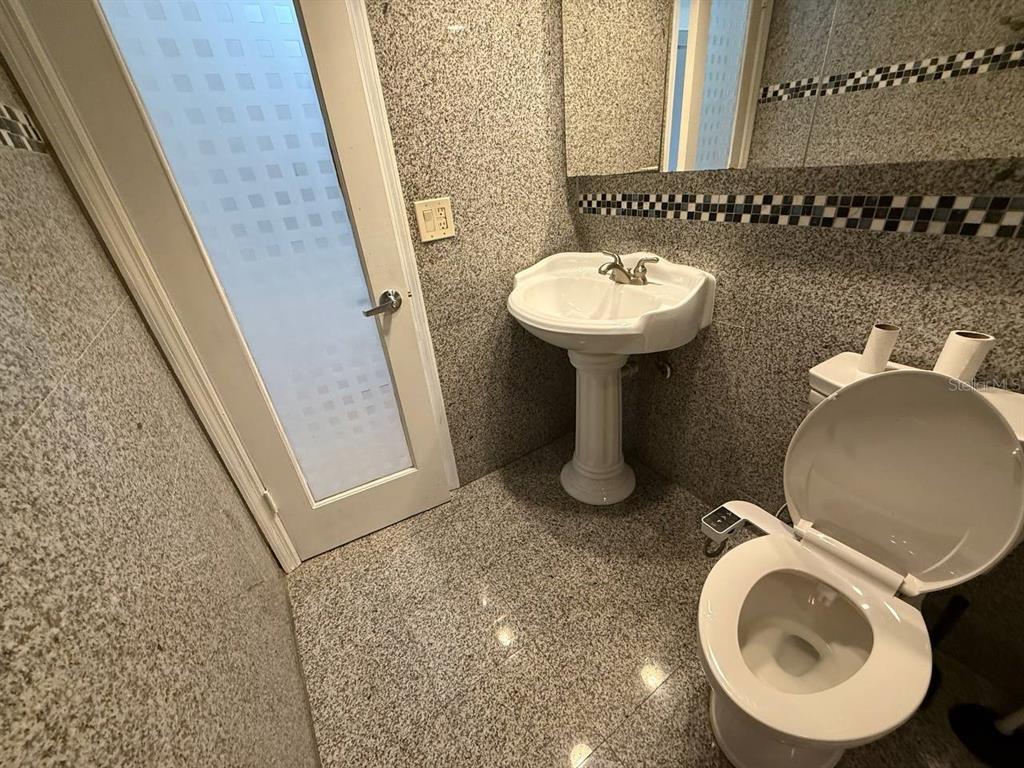 1217 McMullen Booth Road Clearwater, FL 33759 - Photo 35 of 44 a bathroom with a sink and a mirror