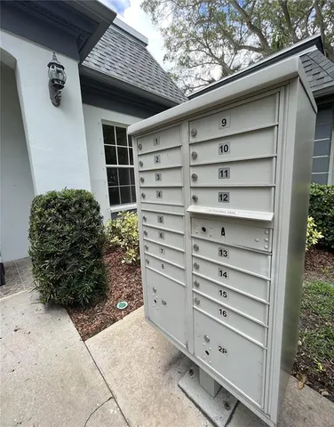 a living room with furniture a large window and table