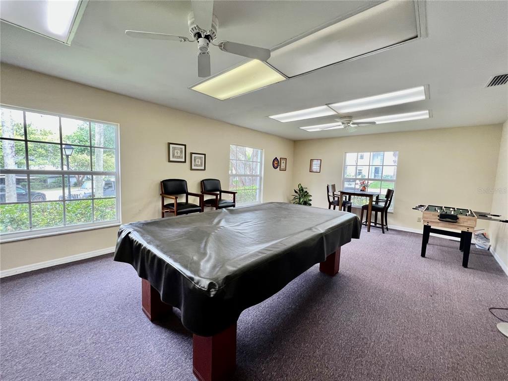 1217 McMullen Booth Road Clearwater, FL 33759 - Photo 39 of 44 a living room with furniture a large window and table