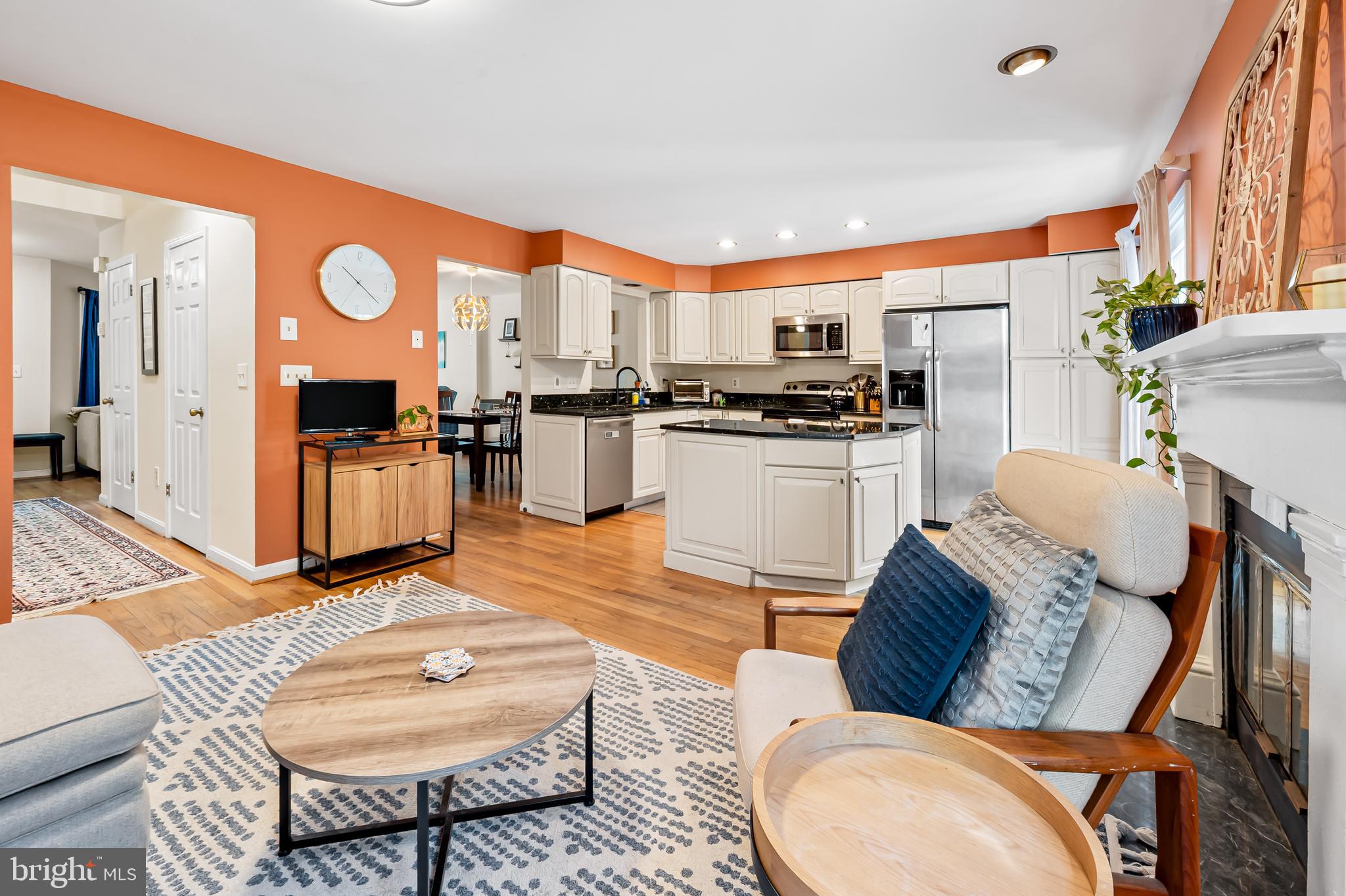 167 Spring Pl Way Annapolis, MD 21401 - Photo 17 of 38 a living room with stainless steel appliances furniture a rug and a kitchen view
