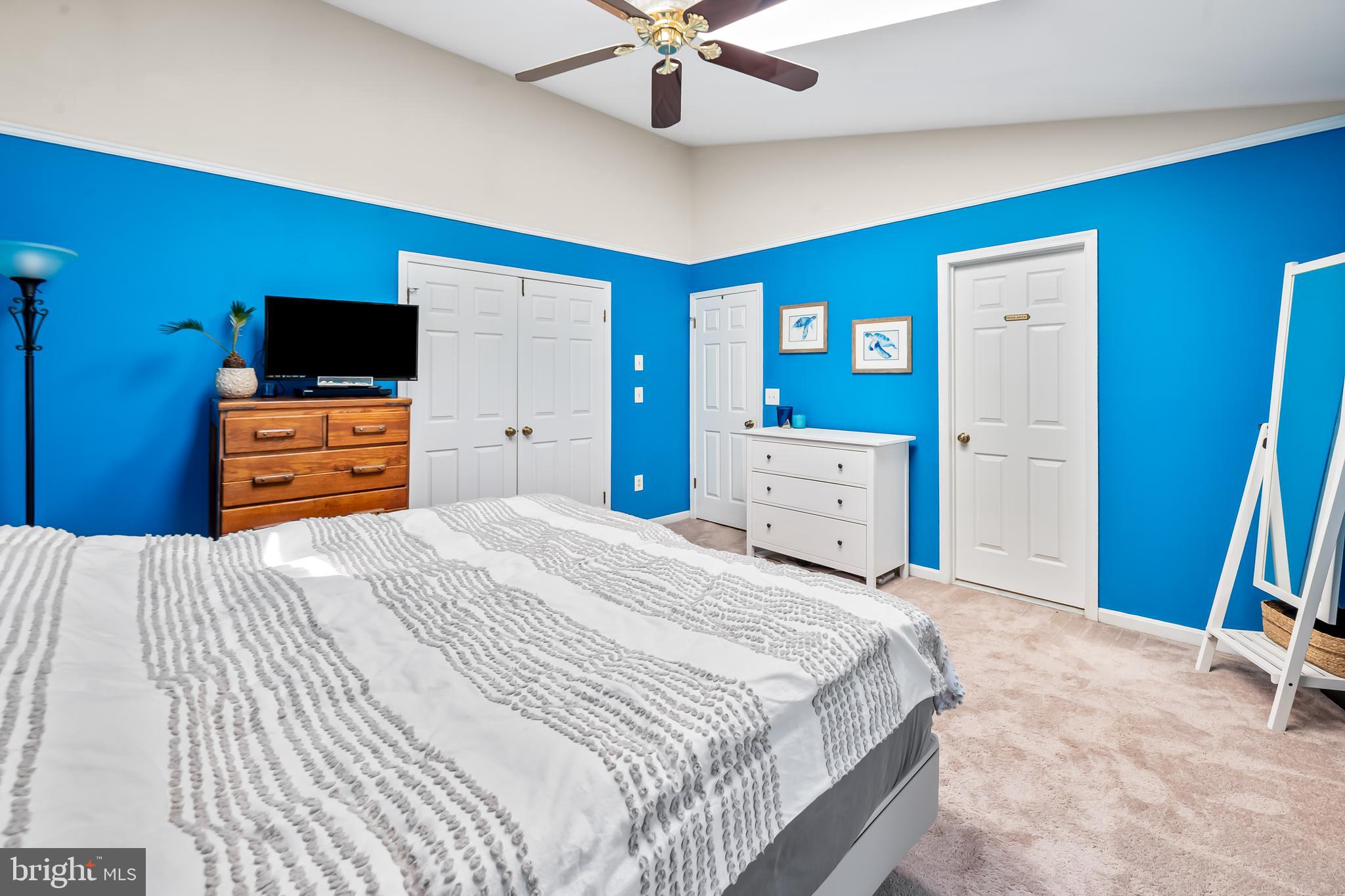 167 Spring Pl Way Annapolis, MD 21401 - Photo 19 of 38 a bedroom with a bed and a chandelier