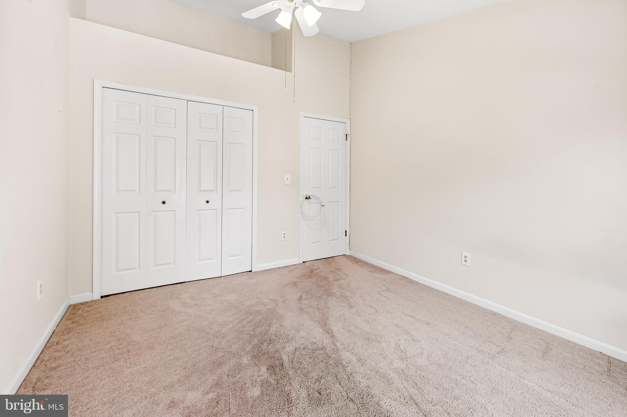 167 Spring Pl Way Annapolis, MD 21401 - Photo 28 of 38 an empty room with a chandelier fan