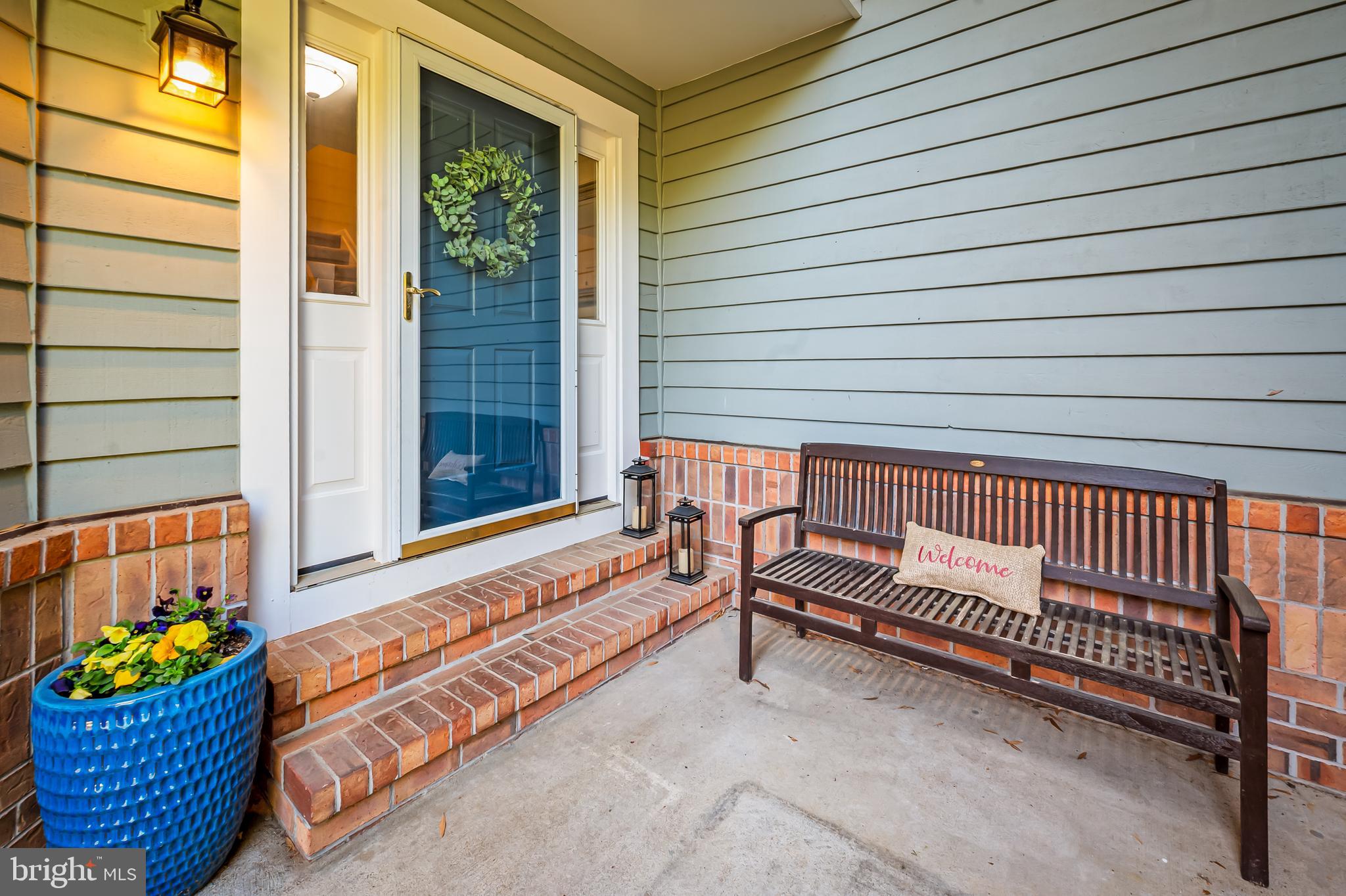167 Spring Pl Way Annapolis, MD 21401 - Photo 3 of 38 a bench sitting in front of a door