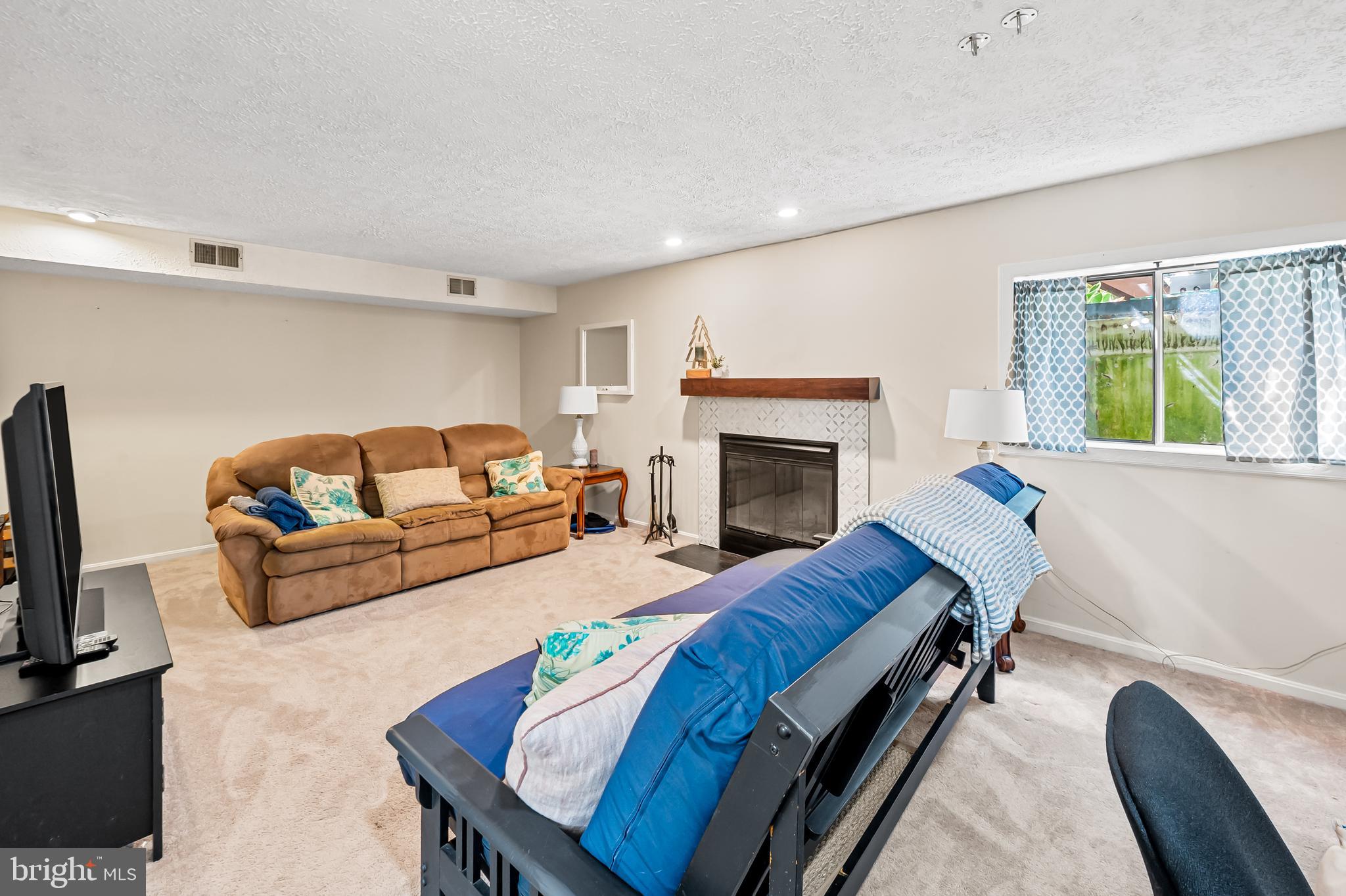 167 Spring Pl Way Annapolis, MD 21401 - Photo 31 of 38 a living room with furniture and a fireplace
