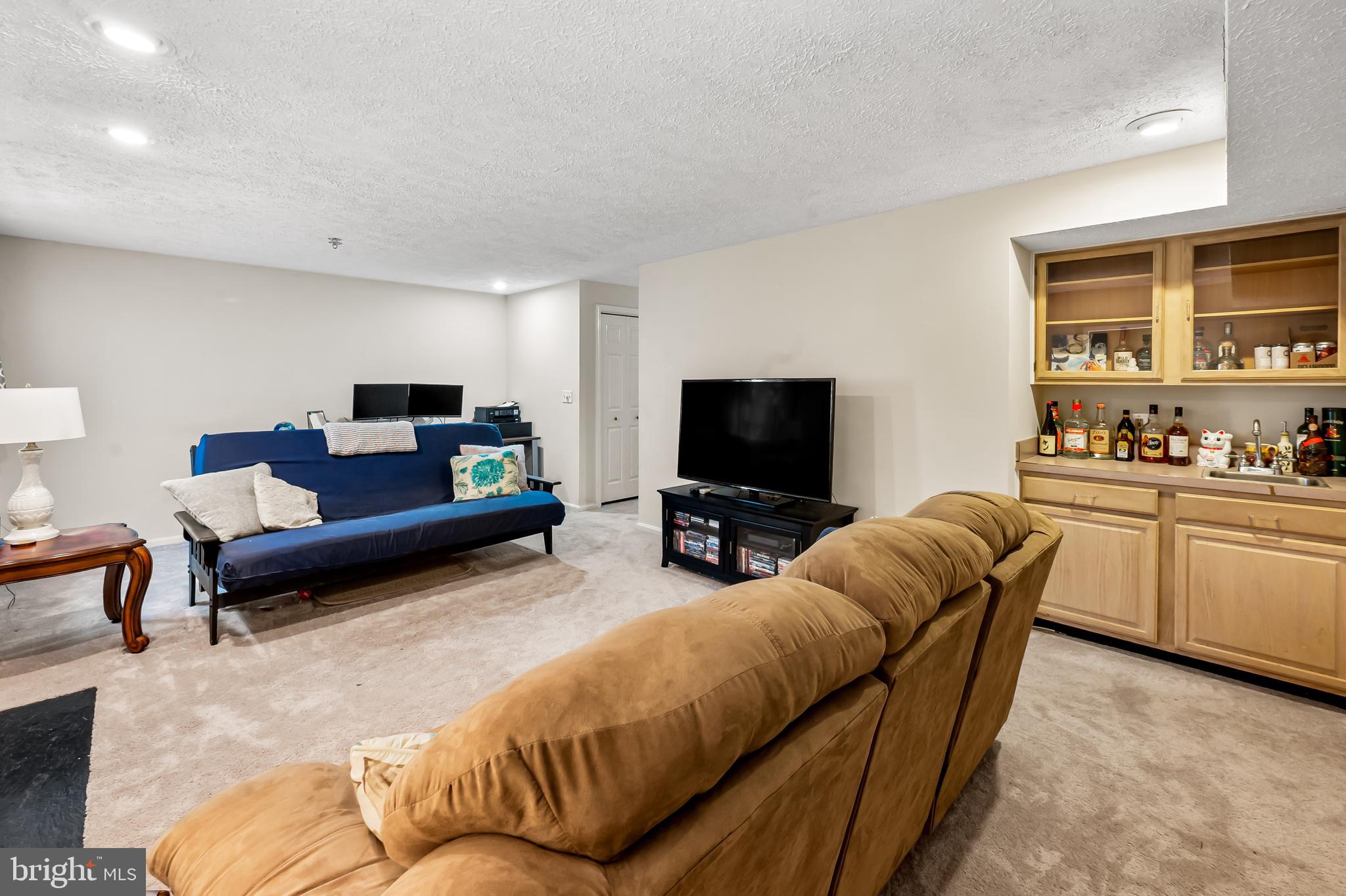 167 Spring Pl Way Annapolis, MD 21401 - Photo 33 of 38 a living room with furniture and a flat screen tv