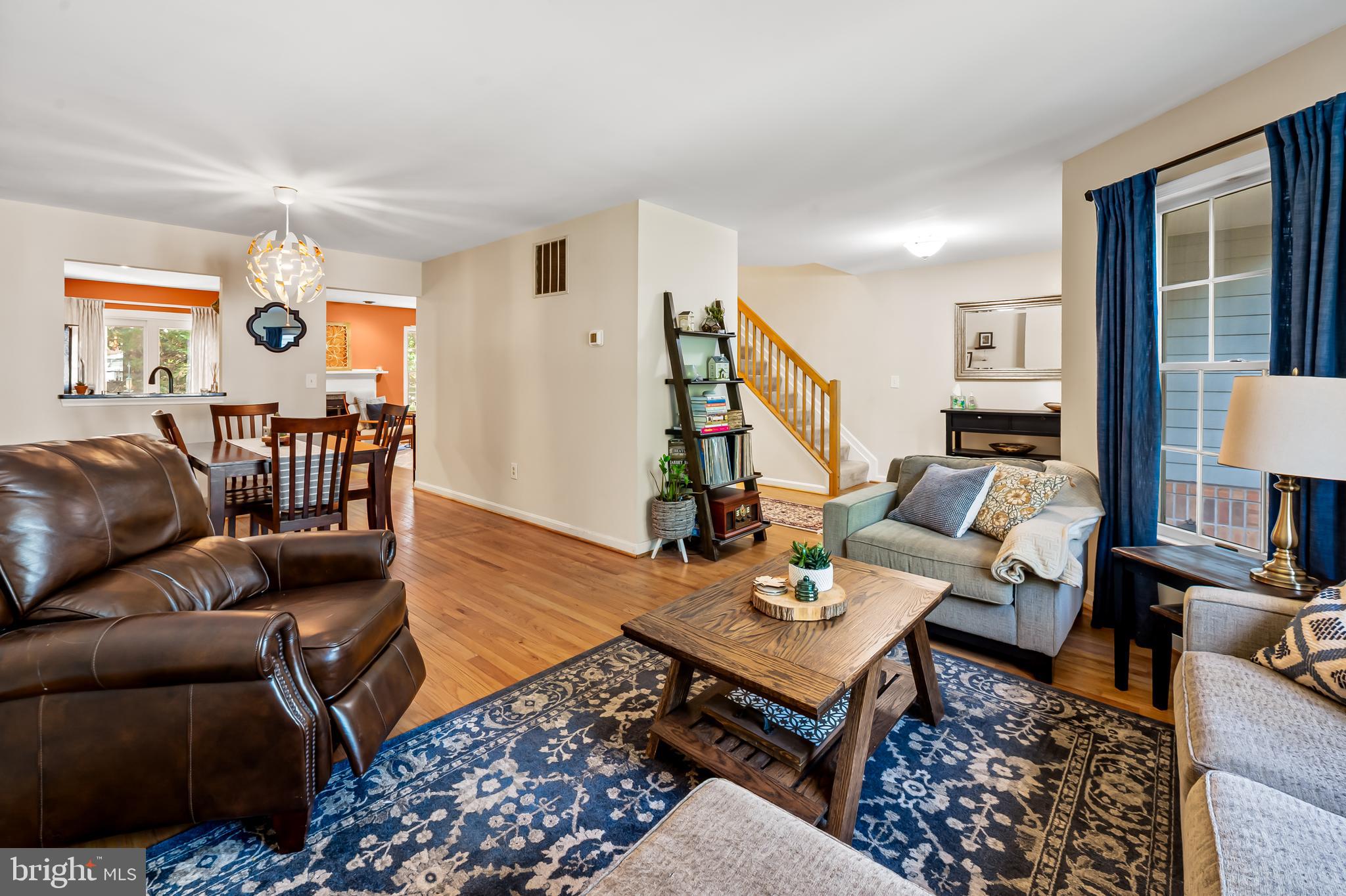 167 Spring Pl Way Annapolis, MD 21401 - Photo 6 of 38 a living room with furniture a rug and a window