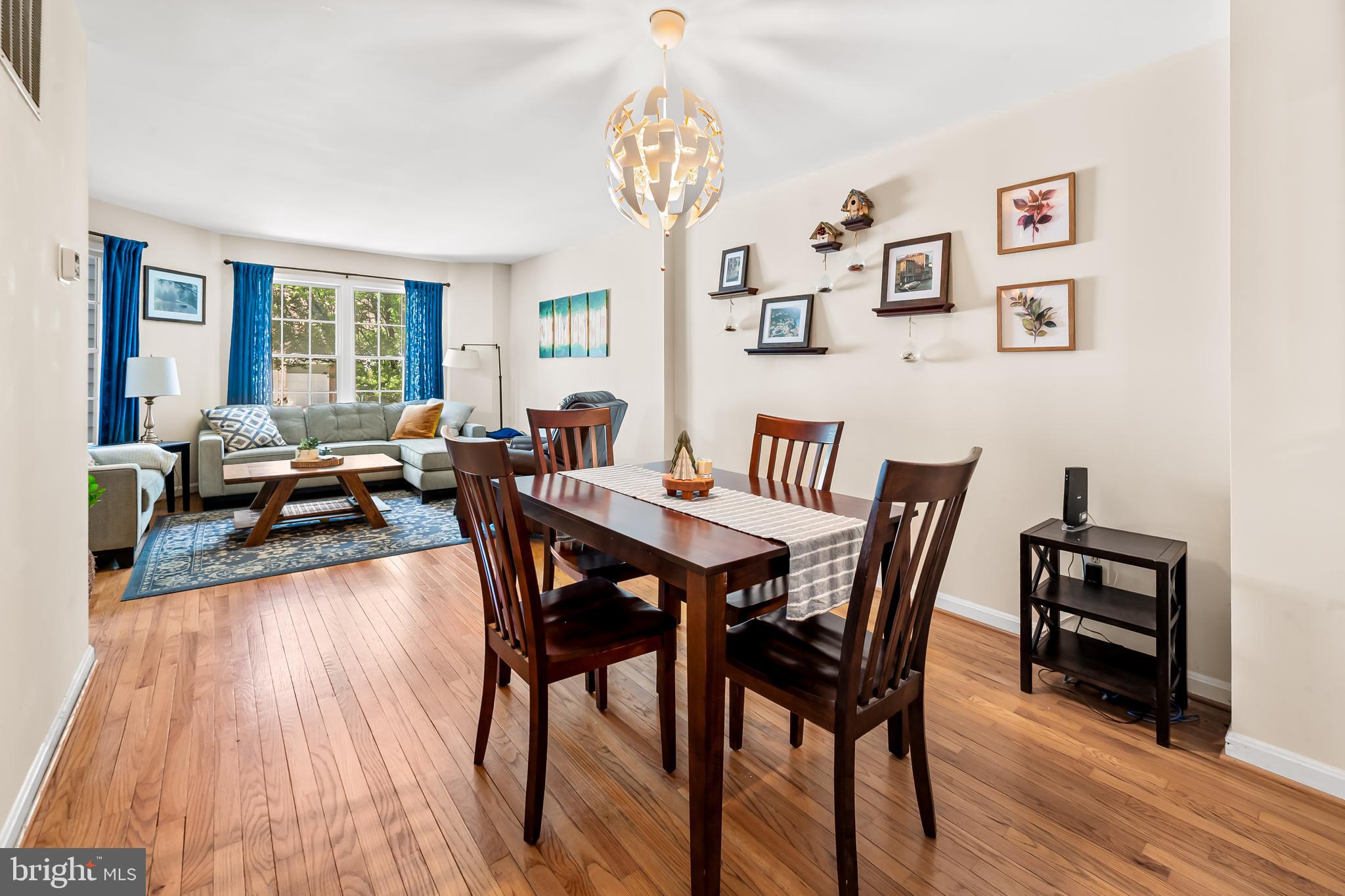 167 Spring Pl Way Annapolis, MD 21401 - Photo 8 of 38 a view of a dining room with furniture wooden floor and chandelier