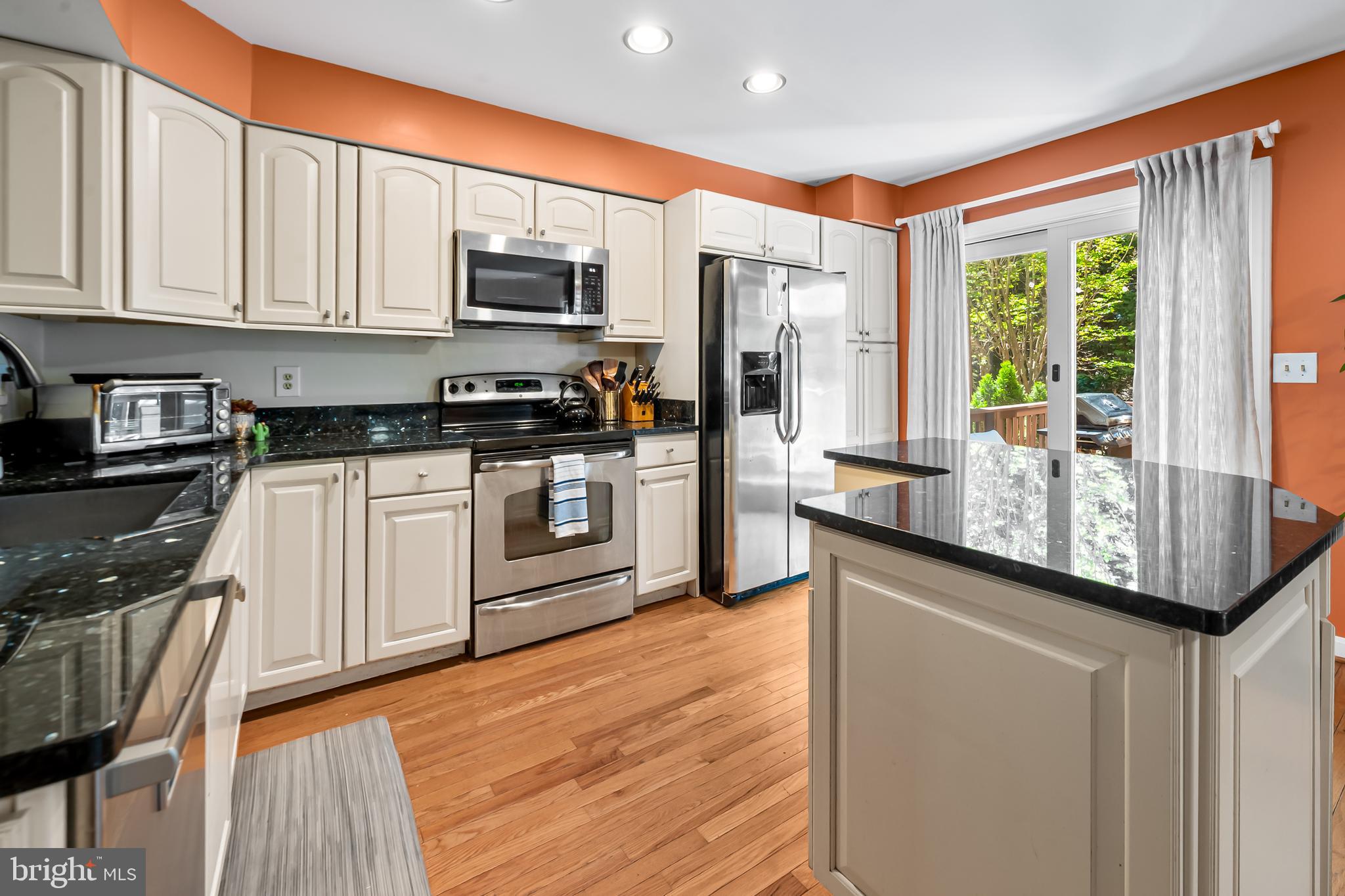 167 Spring Pl Way Annapolis, MD 21401 - Photo 10 of 38 a kitchen with stainless steel appliances granite countertop a stove a sink and a microwave