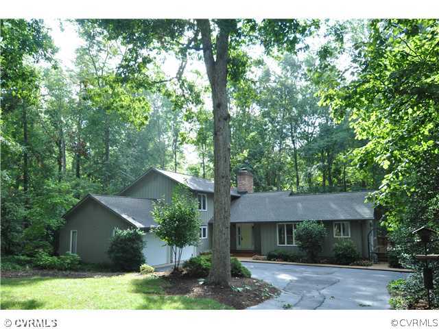 13804 Winterberry Ridge Midlothian, VA 23112 - Photo 1 of 12 a front view of a house with a garden