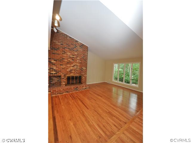 13804 Winterberry Ridge Midlothian, VA 23112 - Photo 2 of 12 a view of an empty room with wooden floor and a window