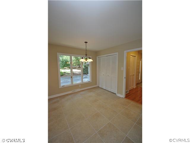 13804 Winterberry Ridge Midlothian, VA 23112 - Photo 4 of 12 a picture of a living room with a large window