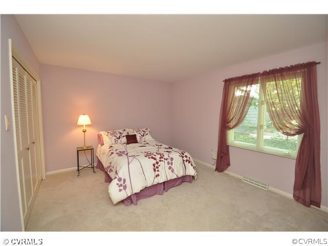 13804 Winterberry Ridge Midlothian, VA 23112 - Photo 9 of 12 a bedroom with a bed and a window