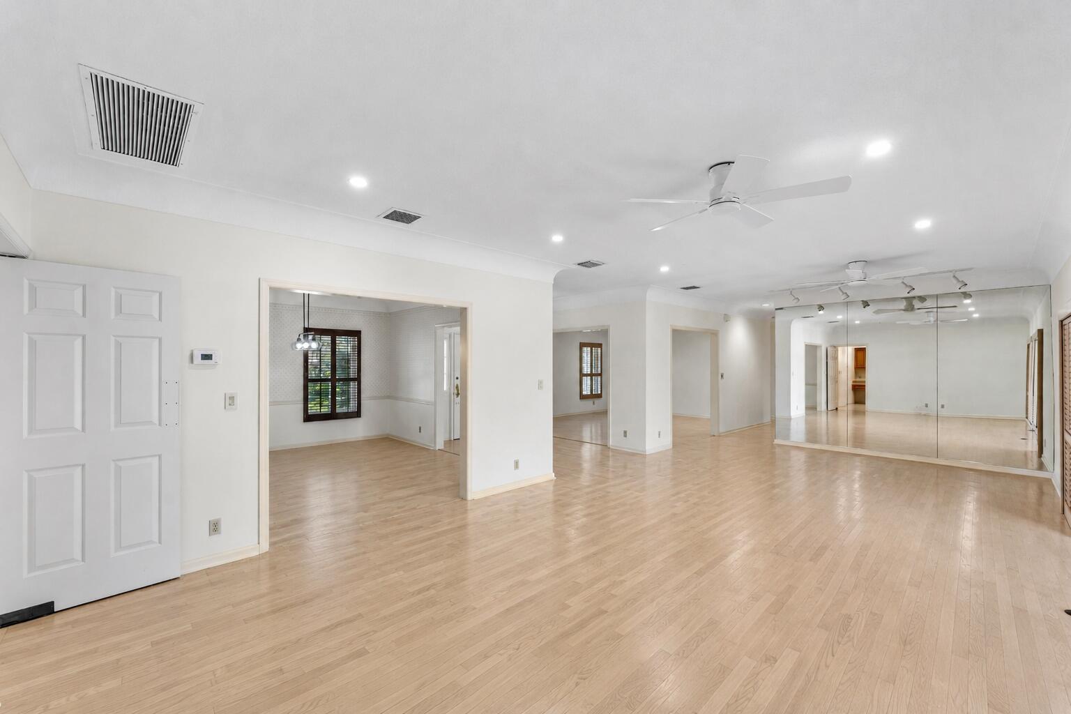 1851 Thatch Palm Drive Boca Raton, FL 33432 - Photo 11 of 70 a view of an empty room with wooden floor